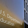 A sign marks the location of the U.S. Department of Education headquarters building