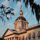 Sunset over the exterior of the historic Florida Capitol Building in Tallahassee, Florida.