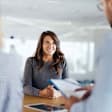 Young female candidate talking to human resource team during a job interview in the office.