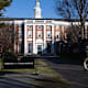 A student walks to class at the Business School on the Harvard University campus in Cambridge, Massachusetts.