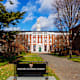 Exterior of the Harvard Business School on the Harvard campus in Boston, Massachusetts. It includes the Baker Library, built in 1927, and the Bloomberg Center, completed in 2005. Named to honor William H. Bloomberg, the late father of NYC former mayor Michael Bloomberg.