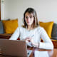 Student woman during E-Learning on laptop at home