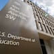 A sign marks the entrance to the US Department of Education headquarters building in Washington, DC.